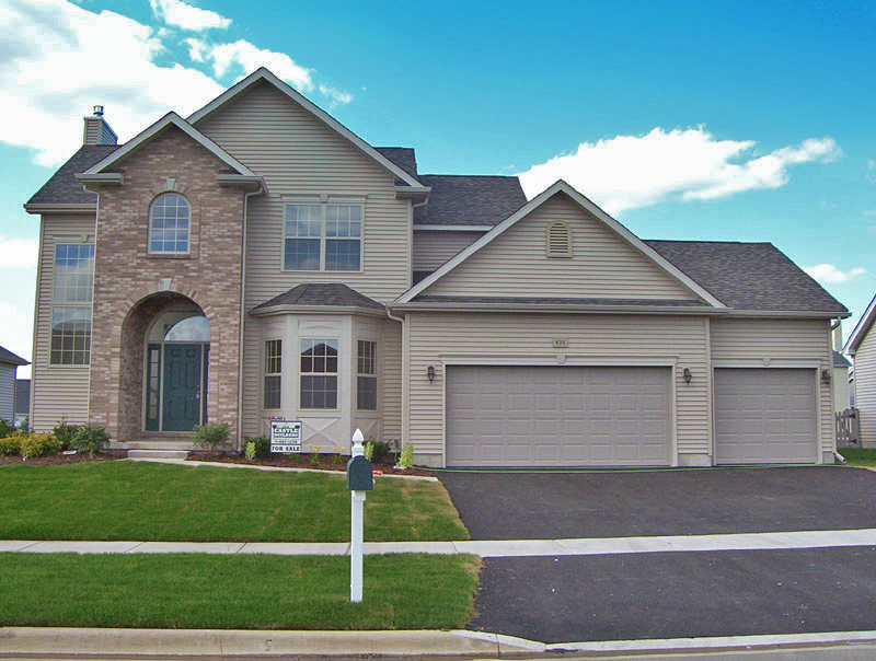 Residential home with professionally installed exterior siding demonstrating code-compliant wall coverings and moisture protection